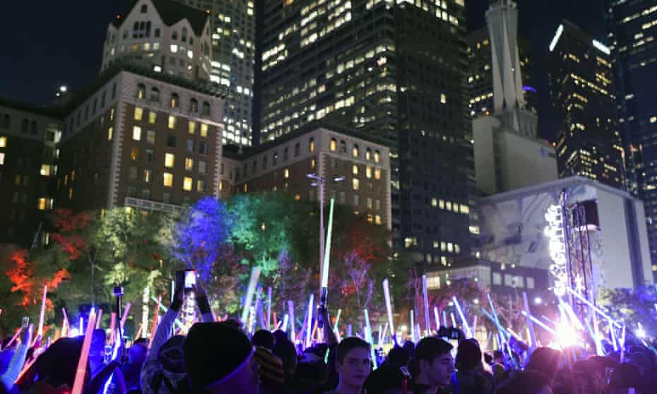 (FILES) This December 18, 2015 file photo shows Star Wars fans as they raise their lightsabers during Lightsaber Battle LA in Pershing Square in downtown Los Angeles, California. “Star Wars: The Force Awakens” set a record for the highest-grossing opening weekend at the US and Canadian box office with an estimated $238 million in sales, industry monitor Rentrak said December 20, 2015.AFP PHOTO / ROBYN BECK ROBYN BECK/AFP/Getty Images