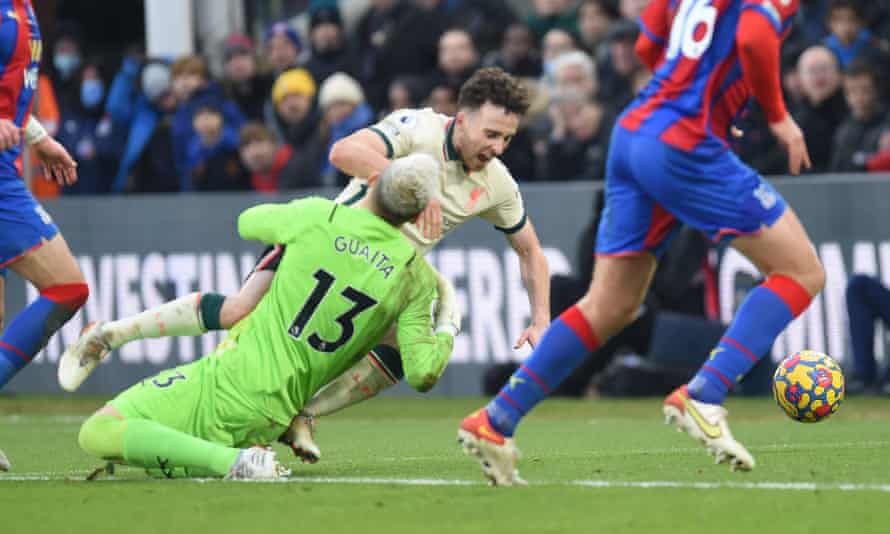 Diogo Jota goes to ground to win Liverpool's late penalty at Crystal Palace.