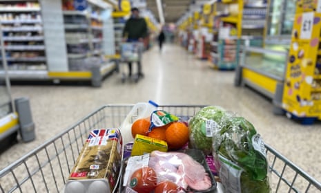 A customer shops for food in a Tesco supermarket 