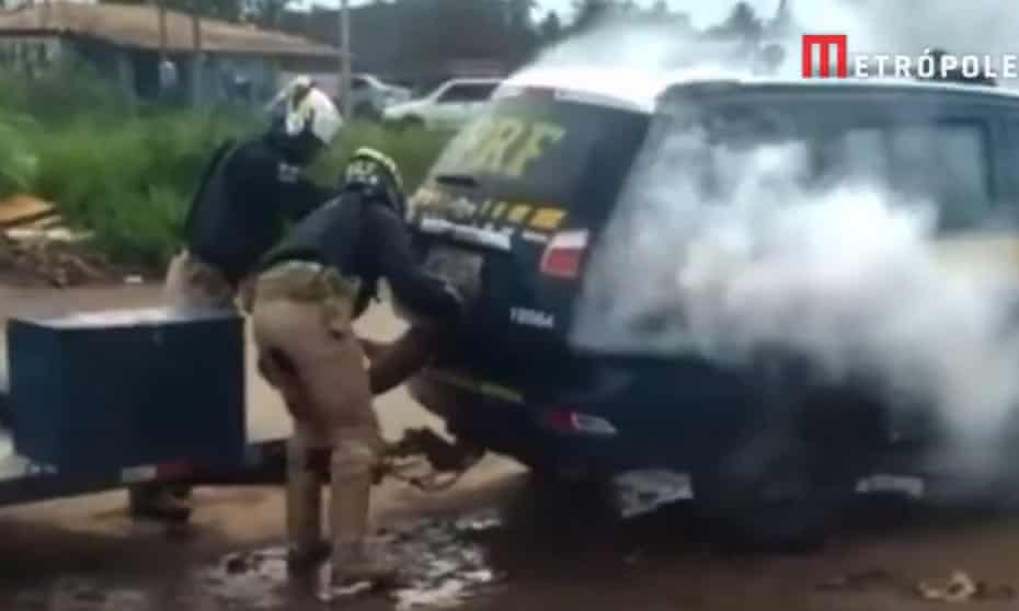 Brazil police arrest mentally ill man and gas him in boot of their car.