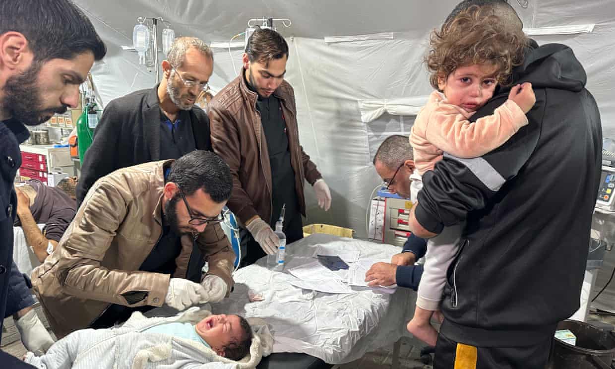 Injured children are brought to Kuwait hospital for treatment following an Israeli attack in Rafah, 25 January 2024. Photograph: Anadolu/Getty Images