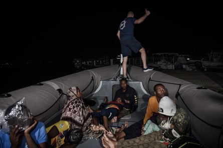 Migrants arrive in Mayotte after being intercepted by border police while sailing at night from Comoros.