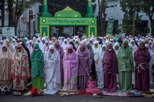 Muslims pray during Eid al-Fitr in Surabaya, Indonesia