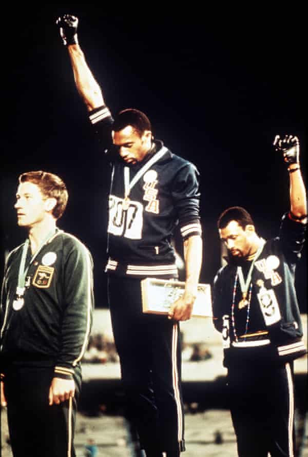 Tommie Smith and John Carlos give the Black Power salute at the 1968 Olympic Games alongside silver medalist Peter Norman.