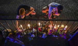 Mourners lay flowers at a memorial for victims of the 4 August mass shooting in Dayton, Ohio.