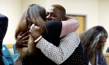 Eric Posey, of Post Falls, Idaho, embraces a supporter in court, after a jury awarded him more than $1.1 million in damages in his defamation lawsuit against conservative blogger Summer Bushnell, Friday, May 24, 2024, in Coeur D'Alene, Idaho. Posey said he suffered harassment and death threats after Bushnell falsely accused him of exposing himself to minors during a performance in 2022. (Kaye Thornbrugh/Coeur D'Alene Press via AP)