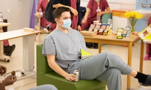 Theo Reback has a break and takes his PPE off.