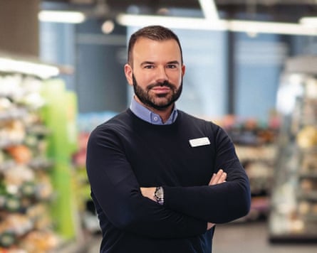 Stuart Machin wth arms folded in a store