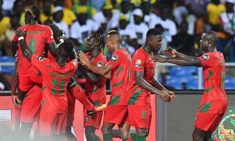 Guinea-Bissau’s players celebrate their last-minute equaliser in the opening game of the Africa Cup of Nations.