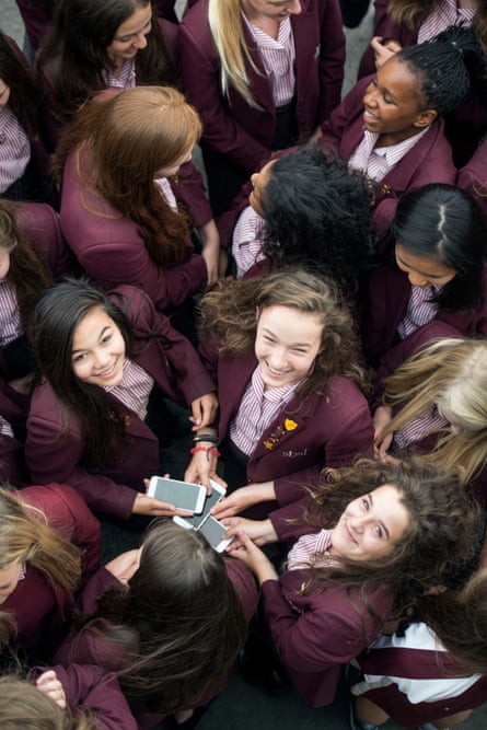 Pupils at Stroud high school with their smartphones.