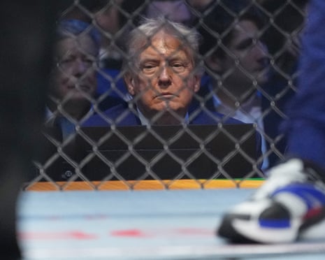 a man looks into a fighting cage