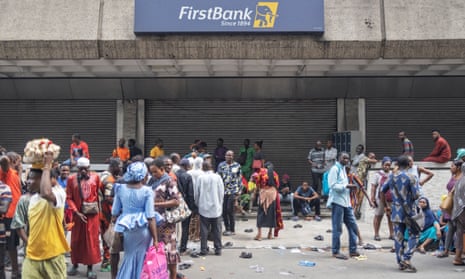 People waiting outside a bank in Lagos hoping to change old Nigerian naira banknotes.