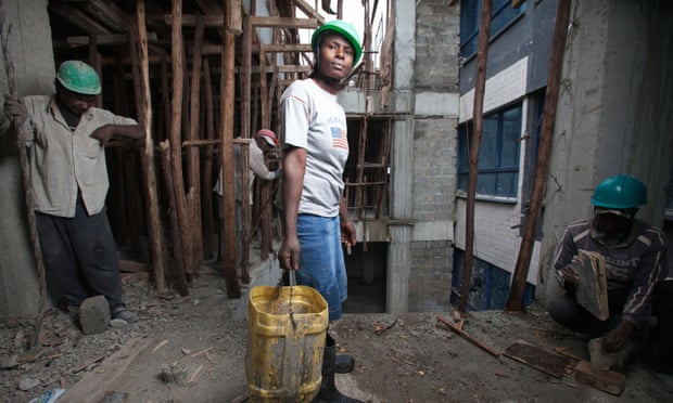 Female construction worker on a high rise building site, Nairobi, Kenya
