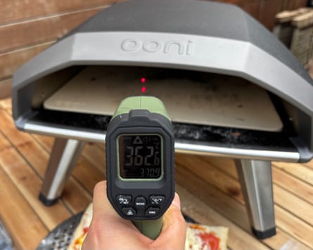 Temperature control ‘gun’ being pointed at the Ooni Koda 2 Pizza Oven to test its temperature prior to putting a pizza in it.