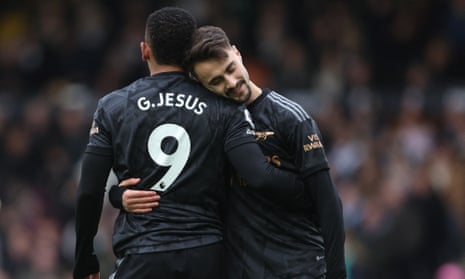 Arsenal’s Fábio Vieira embraces his teammate Gabriel Jesus.