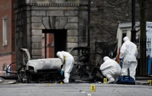 Derry, Northern Ireland Forensic officers inspect the scene of a suspected car bomb