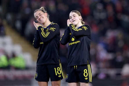 Julia Zigiotti Olme and Jess Park celebrate together.