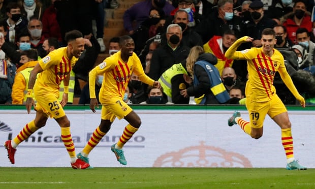 Barcelona's Ferran Torres celebrates scoring their third goal with teammates.