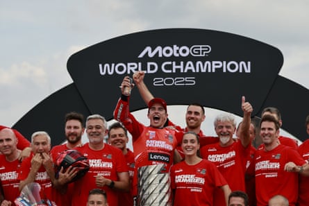 Márquez and the Ducati team celebrate with the MotoGP trophy