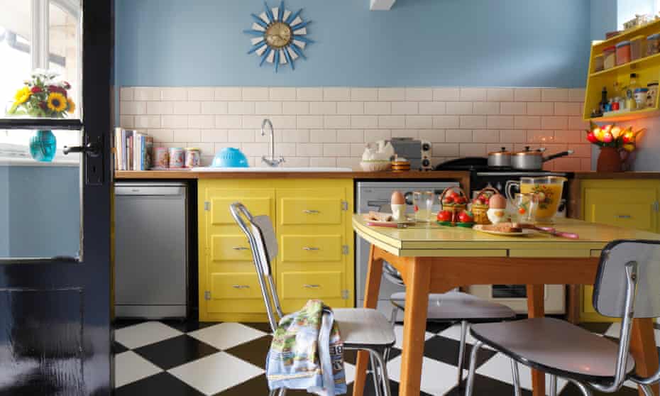 The bright yellow kitchen with a Formica table.