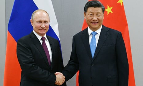 Vladimir Putin and Xi Jinping pose for a photograph before their talks in Beijing, China