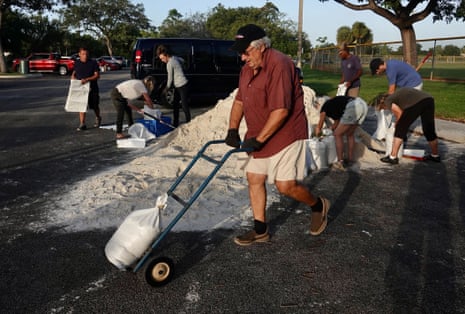 Sandbags are distributed at Mills Pond Park in Fort Lauderdale, Florida, ahead of Tropical Storm Nicole on Tuesday, 8 November 2022.
