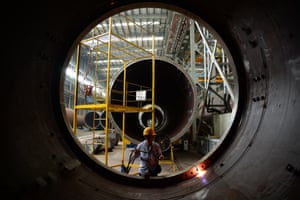 An employee works on production line for wind turbines at a plant of China Construction Equipment and Engineering in Nanjing, Jiangsu Province of China.