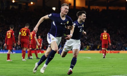 Scott McTominay (left) and Kieran Tierney celebrate during March’s 2-0 win over Spain. A point in Seville on Thursday would secure Euro 2024 qualification.