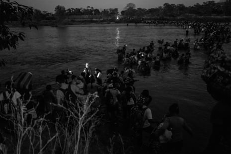 People cross the Suchiate River as they enter Mexico from Guatemala