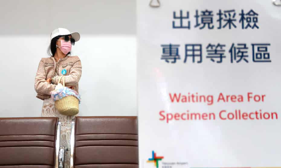 Palau-Taiwan Quarantine Free Travel Starts - 01 Apr 2021Mandatory Credit: Photo by Daniel Tsang/SOPA Images/REX/Shutterstock (11840467d) A woman waits to collect specimen samples for the first flight connecting Taiwan to Palau as Taiwan and Palau start a travel bubble scheme exempting visitors to undergo quarantine. The scheme allows Taiwanese people and Palauans to travel to each country without having to quarantine but gatherings and visits to crowded areas are prohibited whilst self management is compulsory for 9 days upon arrival to their home countries. But a COVID test before boarding the aircraft is required. Palau-Taiwan Quarantine Free Travel Starts - 01 Apr 2021