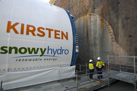 Workers looking at a boring machine which is part of the Snowy Hydro project