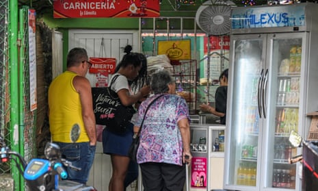 People queue up at business in Havana