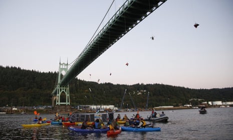 Activists hang under the St Johns Bridge in Portland, Oregon, in an attempt to block the Shell-leased icebreaker MSV Fennica.