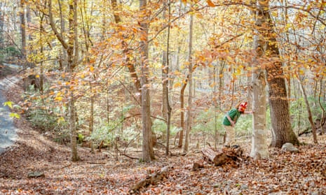 Newton, a boy on the autism spectrum, in a wood, wearing a red and white mask, 2015