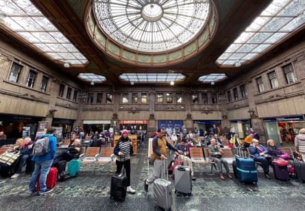 Travelers at Edinburgh Waverley Station in May 2022