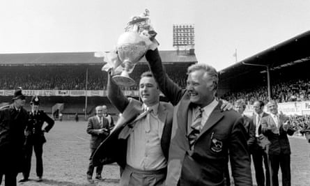 Brian Clough (left) and his assistant Peter Taylor show off the League Championship trophy to the jubilant Derby County fans in May 1972