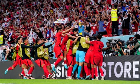 South Korea celebrate their winning goal which took them into the knockout stages