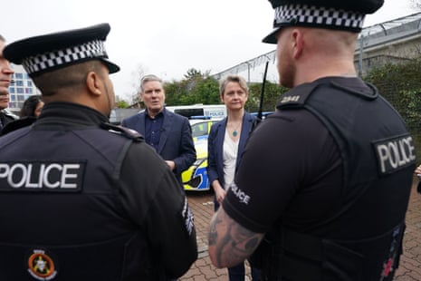 Keir Starmer and Yvette Cooper talking to police officers during a visit to Milton Keynes police station this morning.