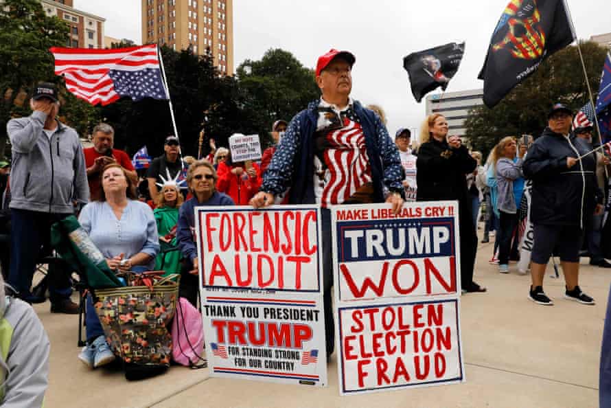 Protesters call for a 'forensic audit' of the 2022 presidential election, during a demonstration by a group called Election Integrity Fund and Force outside of the Michigan State Capitol , in Lansing, Michigan, on 12 October 2021.