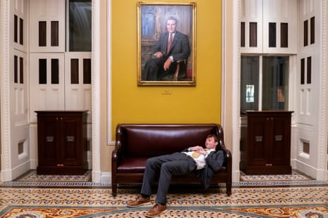 A senate staffer rests outside the Senate chamber as Republican lawmakers struggle to pass U.S. President Donald Trump's sweeping spending and tax bill, on Capitol Hill in Washington, D.C., U.S., July 1, 2025.