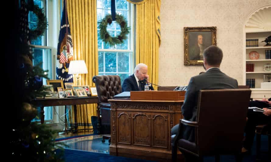 Joe Biden talks on the phone with Ukrainian President Volodymyr Zelensky from the Oval Office at the White House on December 09, 2021.