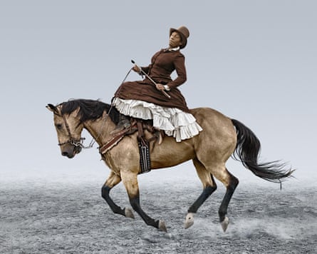 A woman on horseback in traditional dress and a hat.