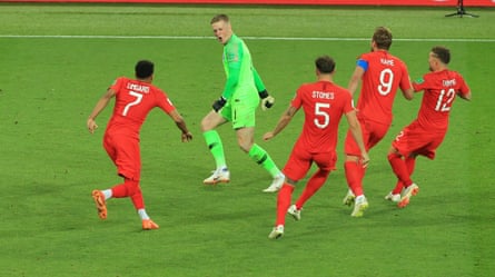 Jordan Pickford is chased by his England teammates after his winning save in penalty shootout against Colombia in the 2018 World Cup