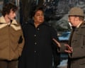 Dominic Sessa, Da’Vine Joy Randolph and Paul Giamatti in The Holdovers, in coats in a street at night