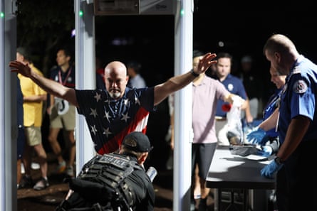 A golf fan passes through airport-style security screening before the Friday morning foursomes at the 2025 Ryder Cup.