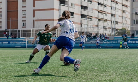 A Club Esportiu Europa player goes for the ball during their second division match against Cacereño in March 2024.