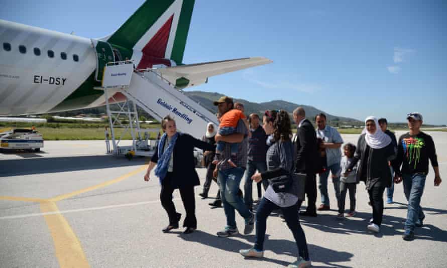 A group of Syrian refugees arrive to board a plane to travel to Italy with Pope Francis