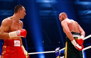 Fury goads Klitschko, butting his hands behind his back and sticking his chin out for a moment