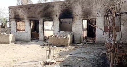 A burned out building with blackened walls.