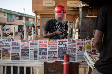 A newspaper stand displays the day’s front-pages in Dakar, Senegal.
